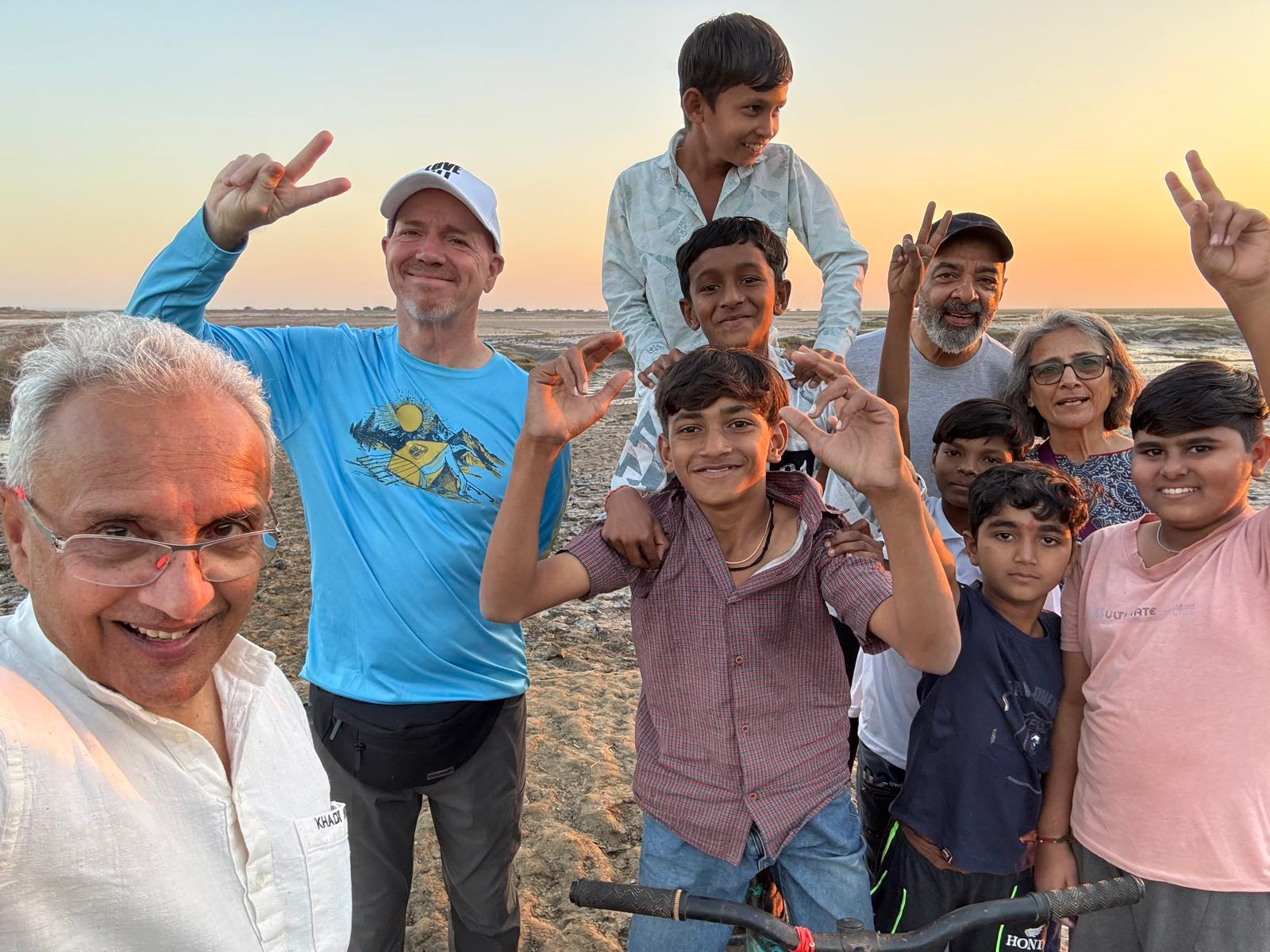 Ron with children near sunset in India